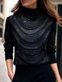 Détail d'un haut noir à manches longues avec d'élégants motifs de strass argentés en vagues. - S / Hauts / Noir