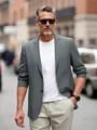 Close-up detail of a lightweight grey men's blazer in a casual outdoor urban setting - S / Tops / Gray