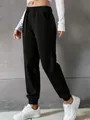 Side view detail of women's black high-waisted joggers featuring drawstring and ribbed cuffs - 3XL / Bottoms / Black