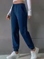 Side view of navy blue women's drawstring joggers with elasticated cuffs - 3XL / Bottoms / Fog Blue