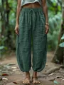 Detail of loose green linen-style harem pants with drawstring elastic waist for women - S / Bottoms / Green