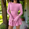 Detail view showing the layered ruffled hem of a pink slim-fit long-sleeve mini dress - Pink
