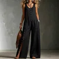 Stylish black sleeveless linen jumpsuit with decorative buttons and side pockets for summer. - S / Top And Bottom / Black