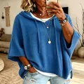 Close-up detail of women's loose blue knitted hooded sweatshirt featuring a drawstring - S / Tops / Blue