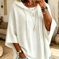 Detailed view of white knitted hooded sweater featuring oversized fit and drawstring design - White