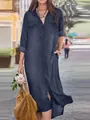 Full-length detail of a navy blue denim shirt dress featuring chest pockets and side slits - M / Dresses / Dark Blue