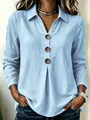 Loose light blue long sleeve top with V-neck, collar, and large brown button detail - M / Tops / Light Blue