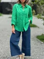 Dettaglio di una camicia verde ricamata a traforo con una vestibilità ampia e comoda - Taglia M / Top / Verde