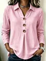Detail view of a pink long-sleeved blouse featuring a V-neck, collar and brown buttons - S / Tops / Pink