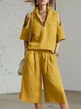 Modelo luce conjunto de verano amarillo mostaza con top de hombros caídos y shorts anchos - S / Top Y Pantalón / Amarillo