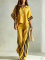 Detailed shot of yellow two-piece set for women featuring stylish black side stripes - Yellow