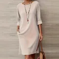 Robe beige élégante à col rond avec poches latérales pratiques et manches mi-longues - 3XL / Robes / Blanc Cassé