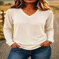 Close-up of comfortable beige V-neck long sleeve t-shirt with soft fabric texture - S / Tops / Off White