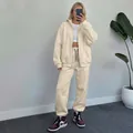 Full body view of a beige oversized fleece zip-up hoodie and matching joggers set - S / Top And Bottom / Apricot