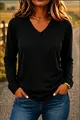 Casual black long-sleeved V-neck T-shirt with a relaxed fit worn by model in outdoor light - S / Tops / Black