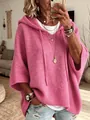 Women's pink hooded knitted poncho sweater with drawstring and relaxed stylish fit. - Pink