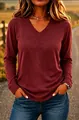 Close-up of a women's casual burgundy V-neck long-sleeve T-shirt in sunset light. - S / Tops / Burgundy
