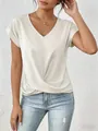 Detail view of an elegant cream V-neck short sleeve top with twist front design. - S / Tops / White