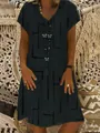 Close-up detail of women's black V-neck short sleeve dress with butterfly print - S / Dresses / Black