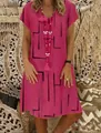 Detailed shot of woman wearing a pink V-neck summer dress with black geometric line print - S / Dresses / Rose Red