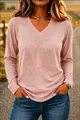 Close-up detail of a women's casual dusty pink V-neck long sleeve tee in soft jersey fabric. - Pink