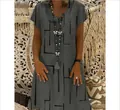 Detail view of a dark grey V-neck dress featuring a black geometric line print. - 3XL / Gray
