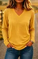 Close-up of mustard yellow V-neck long-sleeved T-shirt with soft knit texture - Lemon Yellow