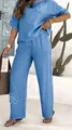 Close-up view of a blue embroidered linen two-piece set featuring high waist wide leg pants - S / Top And Bottom / Blue