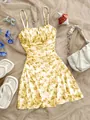 Detailed view of yellow floral French camisole dress with pleated bodice and A-line cut - S / Dresses / Yellow