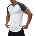 Close-up of a slim fit white and black raglan t-shirt with a unique v-neck cutout design - L / Tops / White/Dark Grey
