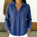 Detail of loose blue button-down shirt with a casual lapel and soft fabric texture - Sapphire Blue