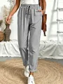 Detailweergave van de casual damesbroek met zwart-witte verticale strepen en trekkoord - S / Bottoms / Grijs