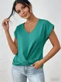 Detail of solid green V-neck blouse with twisted hem and elegant short sleeves - Teal