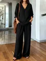 Full view of women's black washed cotton V-neck top and wide-leg trousers set - S / Top And Bottom / Black
