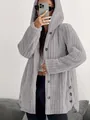 Detail view of a grey fuzzy hooded jacket with button closure and soft plush texture - 3XL / Tops / Light Gray
