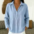 Close-up front view of women's casual light blue button-down long sleeve blouse - Light Blue
