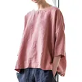 Détail d'une blouse rose en lin surdimensionnée à col rond et tissu texturé de coton - Rose