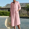 Full view of a pink cotton linen midi dress with V-neck and pockets on a model - S / Dresses / Pink