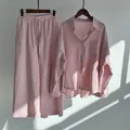 Detailed shot of a pink cotton linen long-sleeved shirt and wide leg trousers set - S / Top And Bottom / Pink