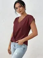 Close-up of elegant burgundy V-neck blouse with twist front and cuffed sleeves - S / Tops / Burgundy