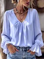Close-up of elegant V-neck pleated blouse with flared ruffle cuffs in light blue - S / Tops / Light Blue