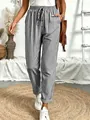 Detailweergave van de casual losse broek met zwart-witte strepen voor dames. - S / Bottoms / Zwart
