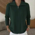 Detailed macro view of the dark green ribbed knit zip-up cardigan with stylish collar - S / Tops / Dark Green