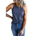Close-up detail of a navy blue halter neck tank top paired with blue denim jeans. - S / Tops / Blue