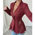 Macro view of a wine red slim fit women's blazer with elegant lace patchwork at the waistline - S / Burgundy