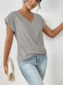 Detail shot of elegant gray V-neck T-shirt with stylish twist hem for women. - Gray