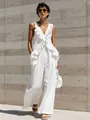 Detailed view of a white cotton linen sleeveless jumpsuit with elegant ruffle trim - S / Set / White