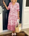 Sommerliches mittellanges Kleid mit Blumenmuster für Damen im stilvollen Design. - Rosa
