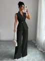 Ganzkörperansicht eines eleganten schwarzen ärmellosen Weste und weite Hose Sets - S / Oberteil Und Unterteil / Schwarz