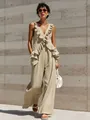 Detailed view of the elegant ruffled V-neck and cotton linen fabric of the beige jumpsuit - Khaki